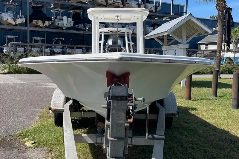 Slide: The Image of 2006 Chaos 16 Bonefish boat on trailer, parked outdoors near marina. - 4