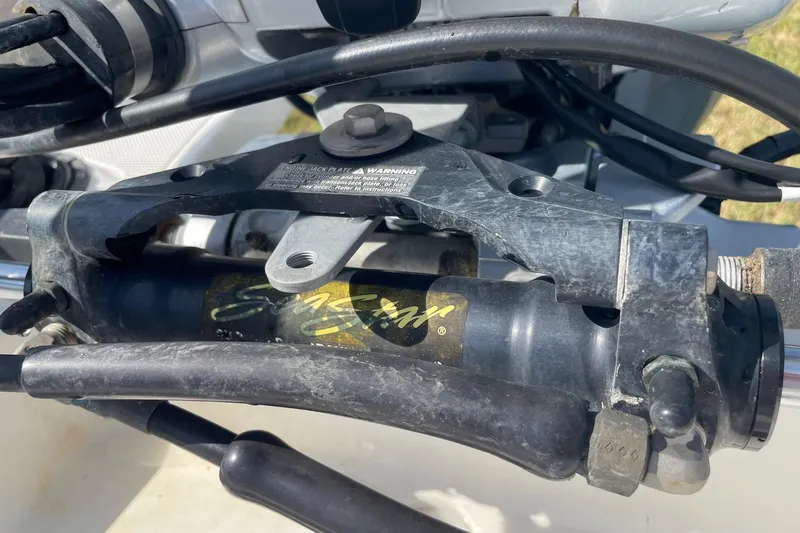 Slide: The Image of Close-up of a 2006 Chaos 16 Bonefish boat engine component with cables and warning label. - 41