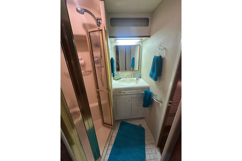 Slide: The Image of Bathroom interior of 1998 Sea Ray 500 Sundancer yacht with shower and sink. - 12