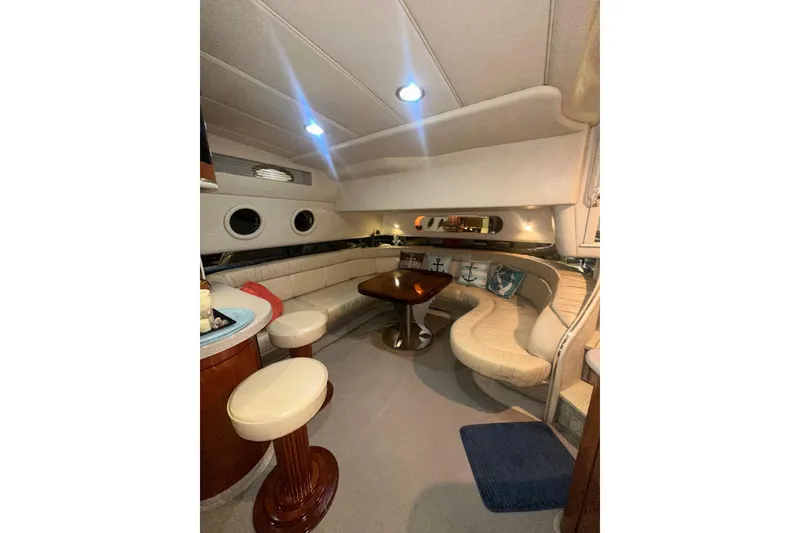 Slide: The Image of Luxurious interior of 1998 Sea Ray 500 Sundancer yacht with elegant seating and ambient lighting. - 16