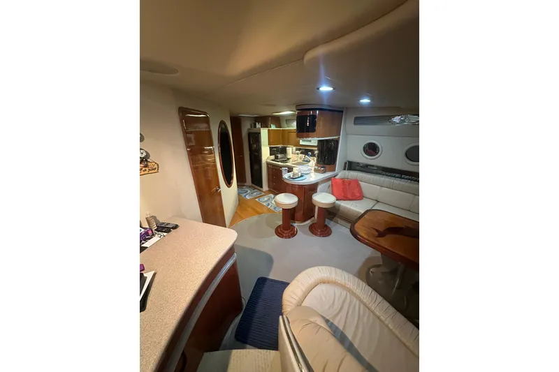 Slide: The Image of Luxurious interior of 1998 Sea Ray 500 Sundancer yacht with modern amenities and seating. - 2
