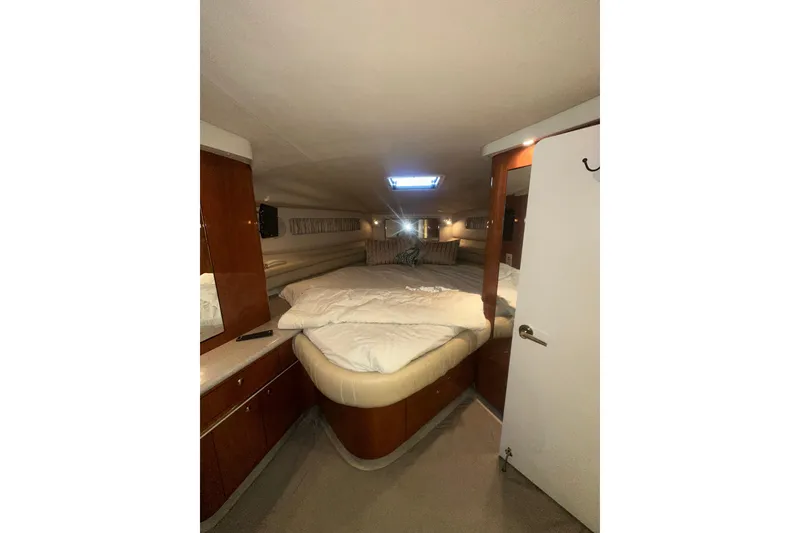 Slide: The Image of Luxurious cabin interior of 1998 Sea Ray 500 Sundancer yacht with cozy bed. - 4