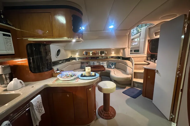 Slide: The Image of Luxurious interior of a 1998 Sea Ray 500 Sundancer yacht with elegant seating and modern amenities. - 5
