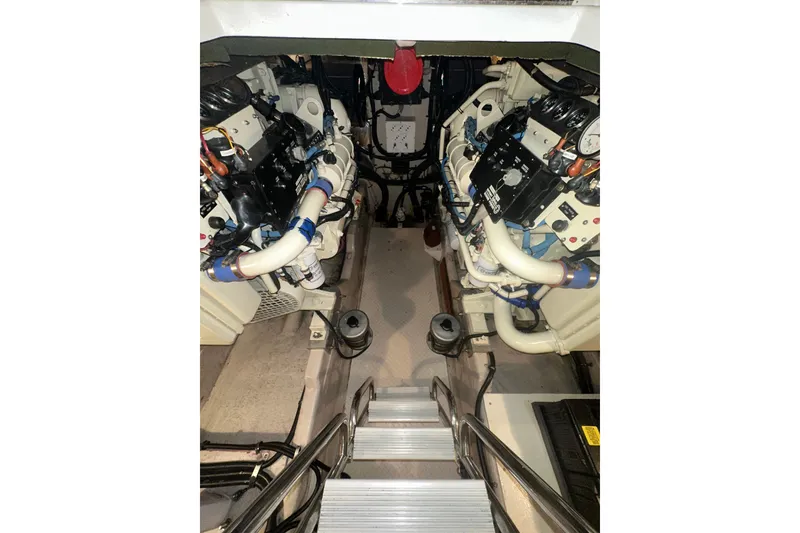 Slide: The Image of Engine room of 1998 Sea Ray 500 Sundancer with visible machinery and components. - 9