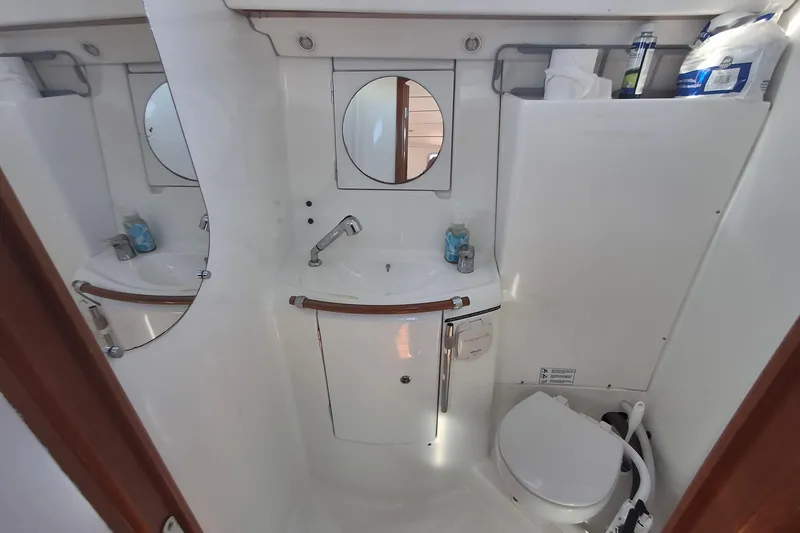 Slide: The Image of Bathroom interior of 2006 Beneteau Oceanis 393 yacht, featuring sink and toilet. - 15