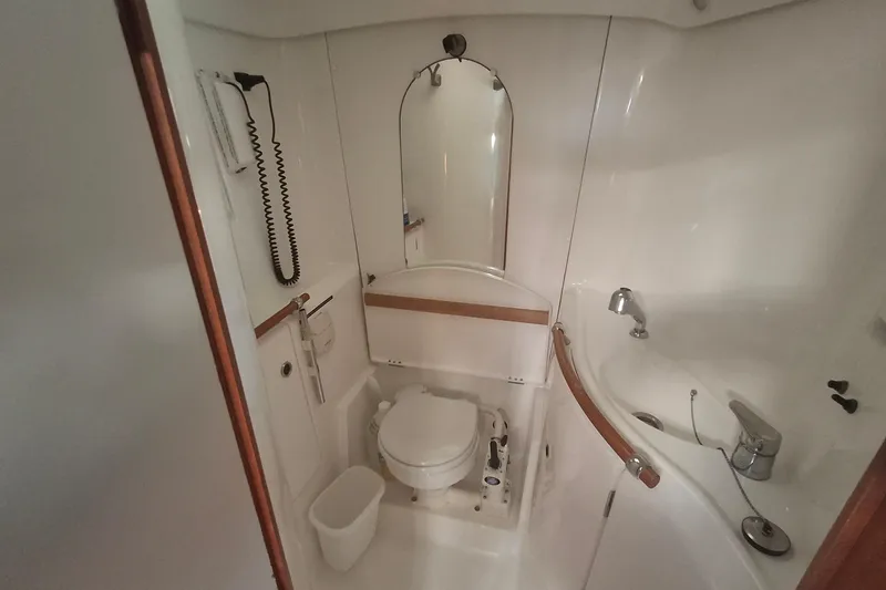 Slide: The Image of Bathroom interior of 2006 Beneteau Oceanis 393 yacht, featuring toilet and sink. - 20