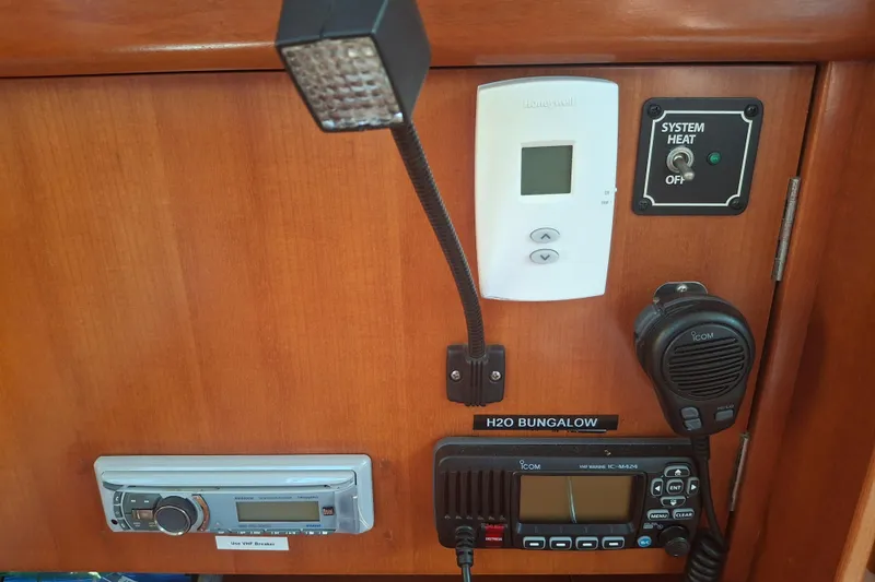 Slide: The Image of Control panel of a 2006 Beneteau Oceanis 393 yacht with communication and heating systems. - 22