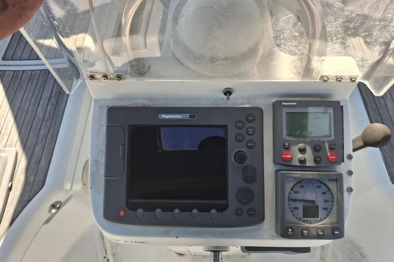 Slide: The Image of Control panel of a 2006 Beneteau Oceanis 393 sailboat with Raymarine navigation instruments. - 8