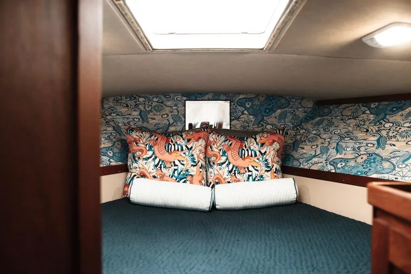 Slide: The Image of Cozy cabin interior of 1982 Trojan F-36 Convertible with vibrant dragon-themed decor. - 12