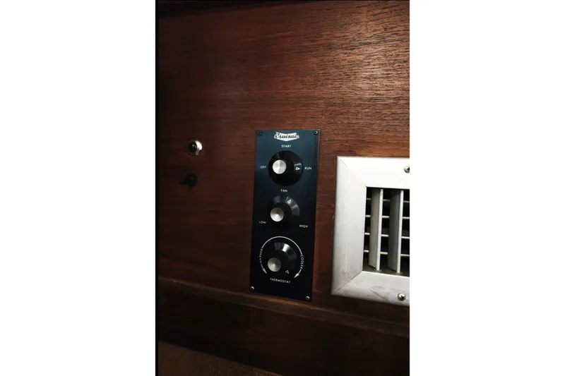 Slide: The Image of Control panel and vent on 1982 Trojan F-36 Convertible boat interior. - 21