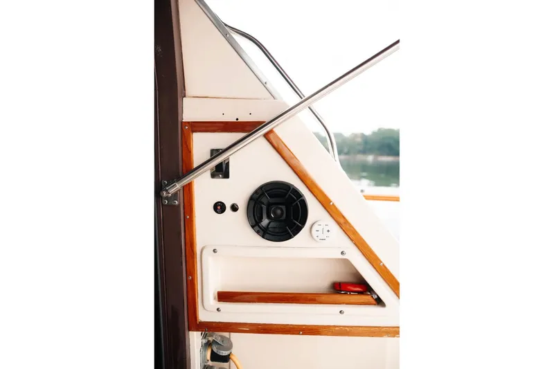 Slide: The Image of 1982 Trojan F-36 Convertible boat interior with speaker and control panel. - 23