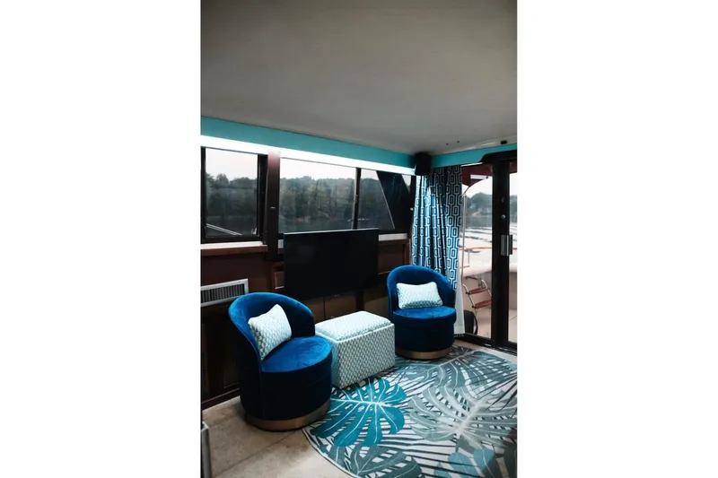 Slide: The Image of Interior of 1982 Trojan F-36 Convertible with blue chairs and patterned decor. - 5