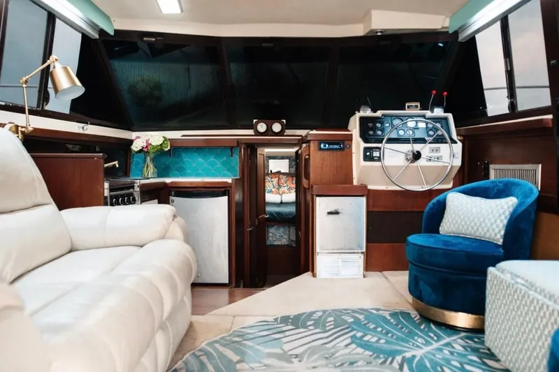 Slide: The Image of Luxurious interior of a 1982 Trojan F-36 Convertible yacht with plush seating and modern amenities. - 7