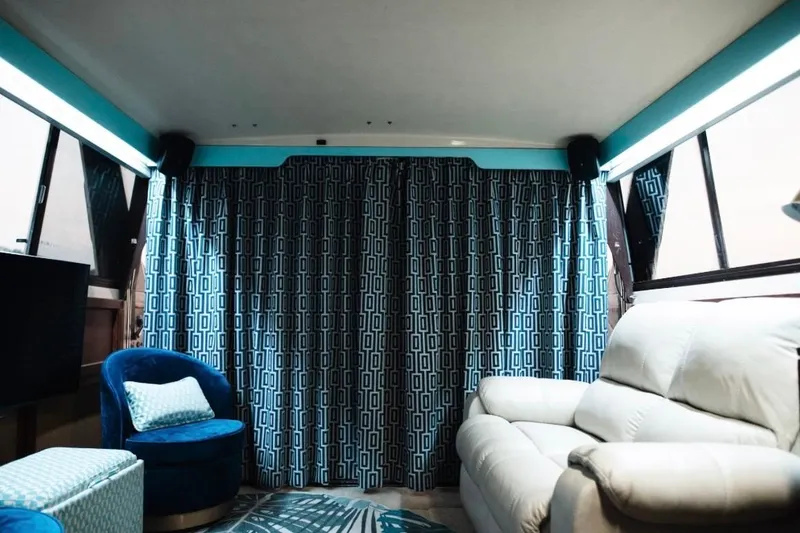 Slide: The Image of Interior of 1982 Trojan F-36 Convertible with blue curtains and modern seating. - 8