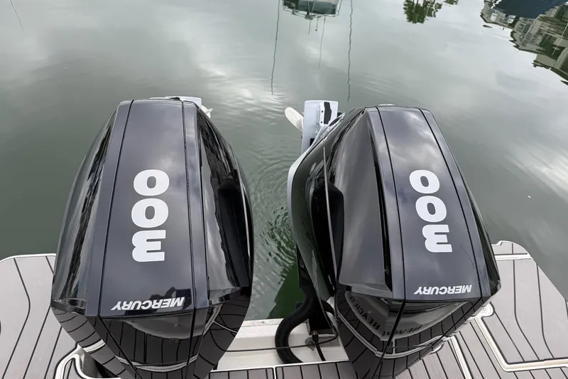 Slide: The Image of Twin Mercury 300 outboard engines on a 2023 Sea Ray SLX 310 boat. - 12