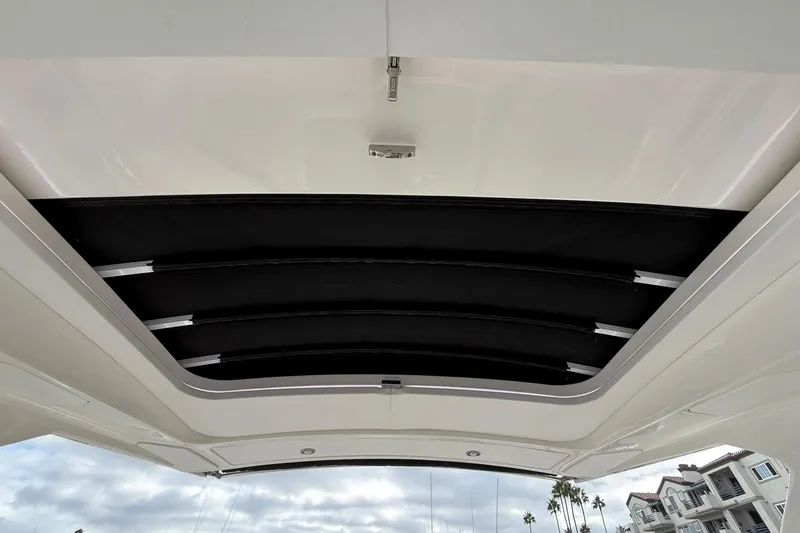 Slide: The Image of 2023 Sea Ray SLX 310 Outboard sunroof, showcasing sleek design and modern features. - 15