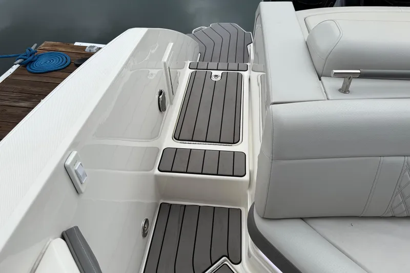 Slide: The Image of 2023 Sea Ray SLX 310 Outboard boat deck with sleek seating and modern design. - 21