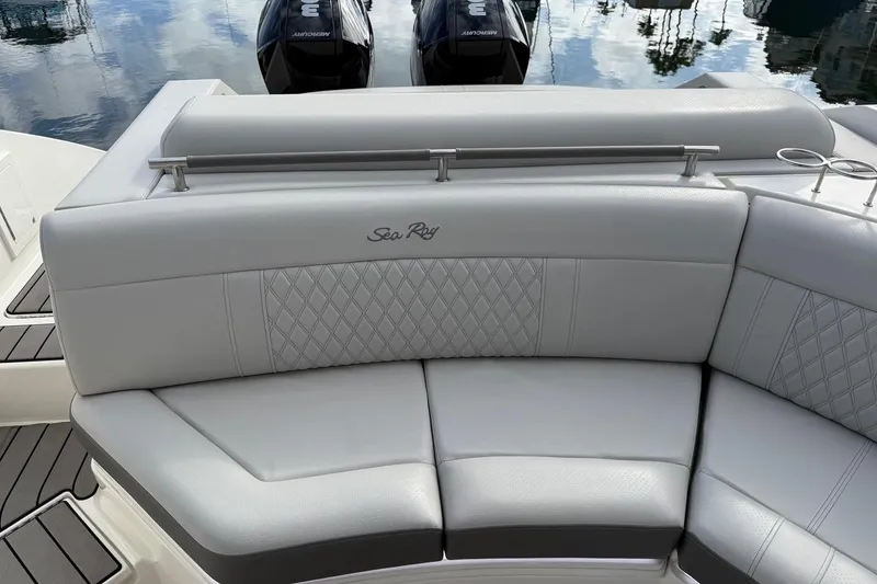 Slide: The Image of 2023 Sea Ray SLX 310 Outboard boat seating with elegant upholstery and dual Mercury engines. - 24