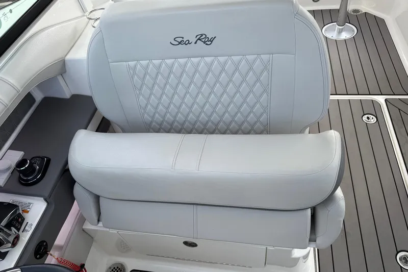 Slide: The Image of 2023 Sea Ray SLX 310 Outboard boat seat with elegant stitching and controls. - 40