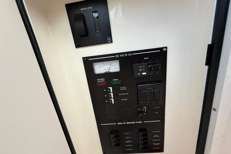 Slide: The Image of Control panel of 2023 Sea Ray SLX 310 Outboard, featuring water level and voltage indicators. - 41