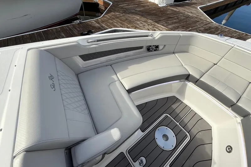 Slide: The Image of Luxurious seating on 2023 Sea Ray SLX 310 Outboard boat, docked at marina. - 42