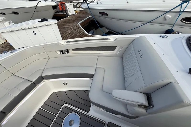Slide: The Image of 2023 Sea Ray SLX 310 Outboard boat interior with luxurious seating and sleek design. - 43