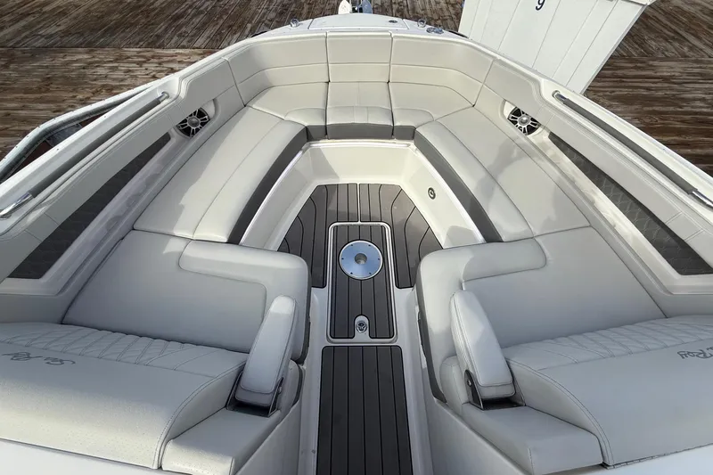 Slide: The Image of 2023 Sea Ray SLX 310 Outboard boat interior with luxurious seating and sleek design. - 44