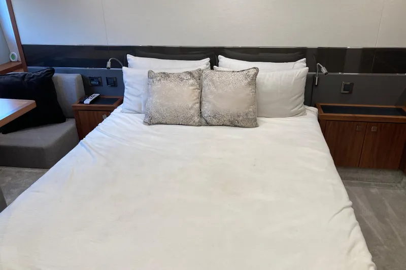 Slide: The Image of 2019 Sunseeker Predator 57 yacht on calm ocean under blue sky. - 10