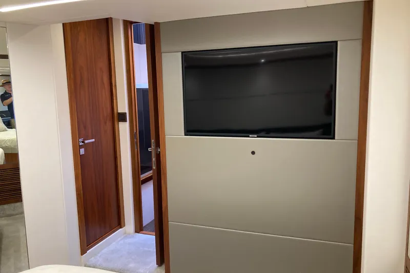 Slide: The Image of 2019 Sunseeker Predator 57 yacht cruising on calm blue waters. - 13