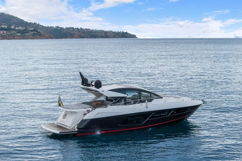Slide: The Image of 2019 Sunseeker Predator 57 yacht on calm blue water. - 18