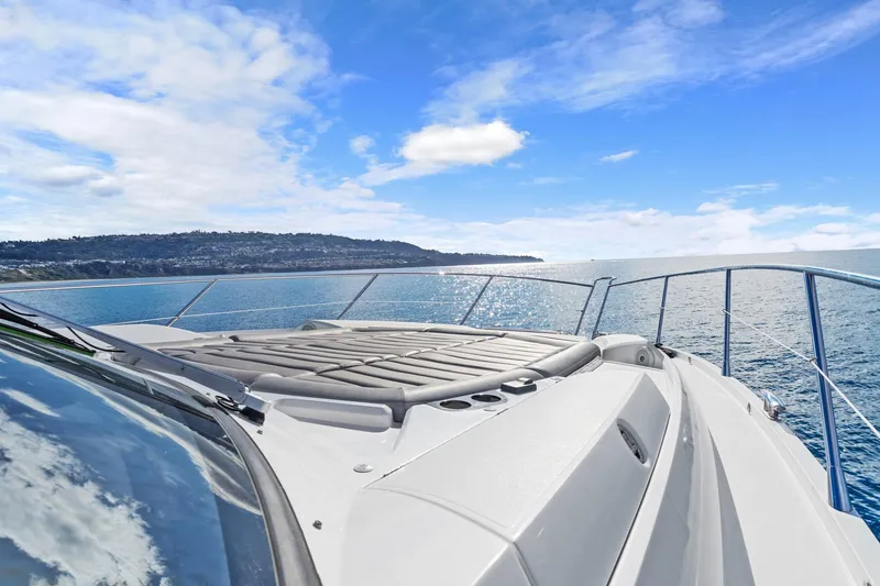 Slide: The Image of 2019 Sunseeker Predator 57 yacht on open water under blue sky. - 27