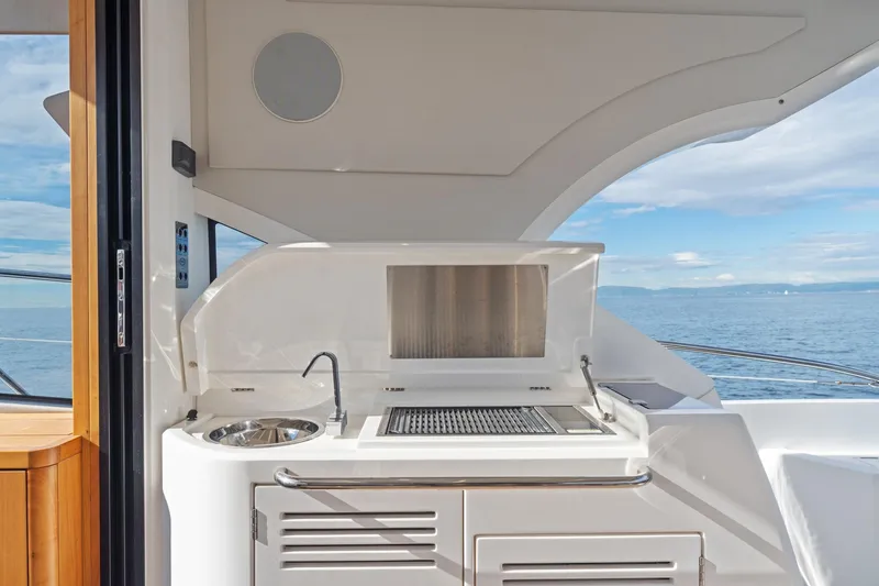 Slide: The Image of Luxurious 2019 Sunseeker Predator 57 yacht interior with sleek seating and panoramic views. - 34
