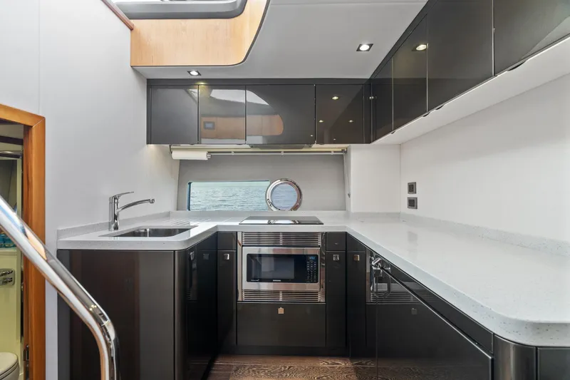 Slide: The Image of Luxurious interior of 2019 Sunseeker Predator 57 yacht with TV and wooden cabinetry. - 37