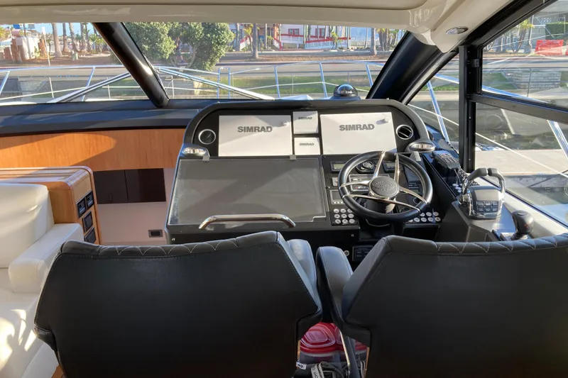 Slide: The Image of 2019 Sunseeker Predator 57 yacht on open sea under blue sky. - 4