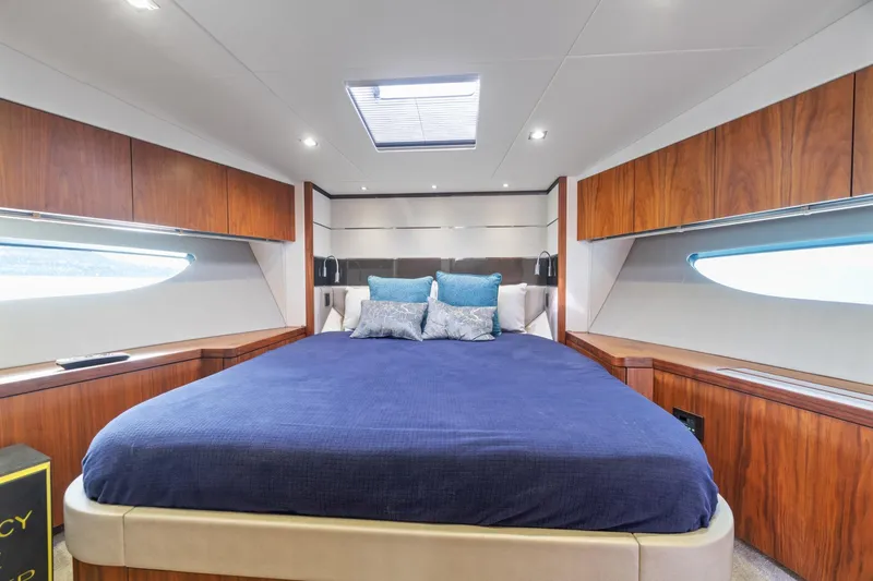 Slide: The Image of 2019 Sunseeker Predator 57 yacht interior with elegant wood finish and cozy seating area. - 41