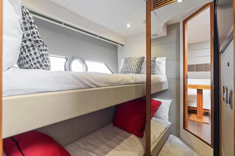 Slide: The Image of Luxurious interior of 2019 Sunseeker Predator 57 yacht with elegant bedroom and seating area. - 47