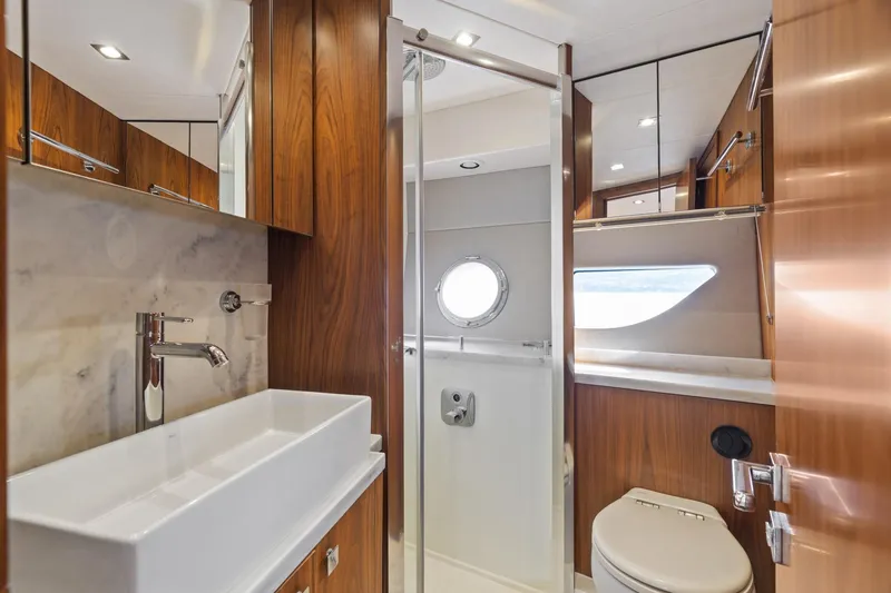Slide: The Image of 2019 Sunseeker Predator 57 yacht interior with cozy bunk beds and modern decor. - 49