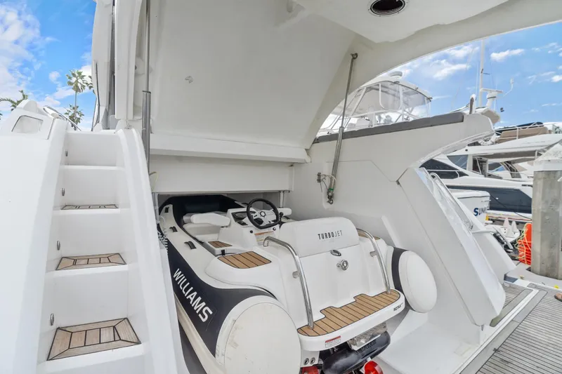 Slide: The Image of 2019 Sunseeker Predator 57 yacht interior storage area with steps and equipment. - 54