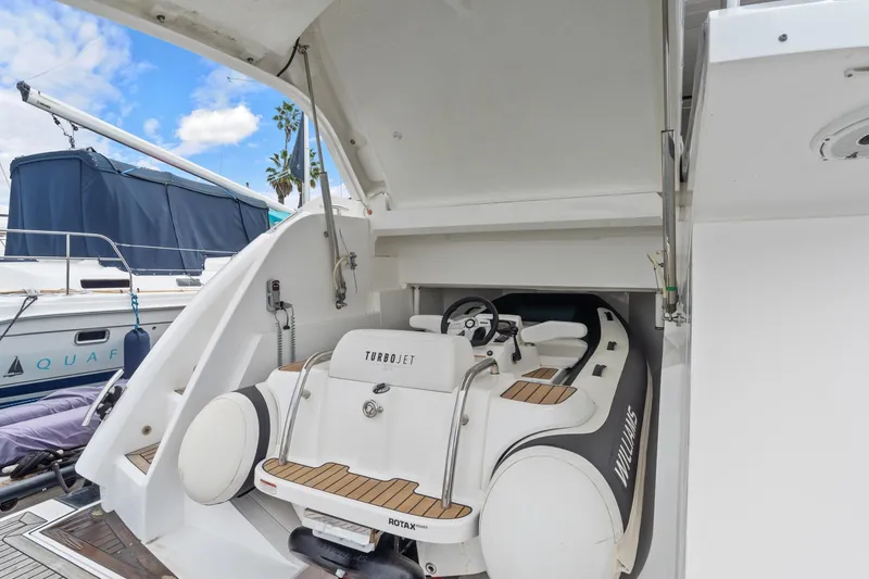 Slide: The Image of 2019 Sunseeker Predator 57 yacht with Williams Turbojet tender in garage. - 55