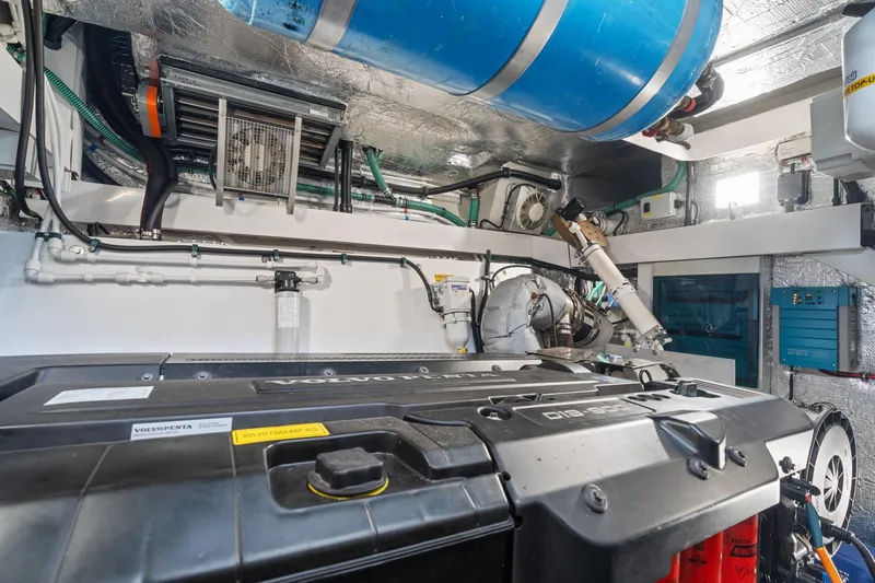 Slide: The Image of Engine room of 2019 Sunseeker Predator 57 yacht, showcasing mechanical components and equipment. - 64