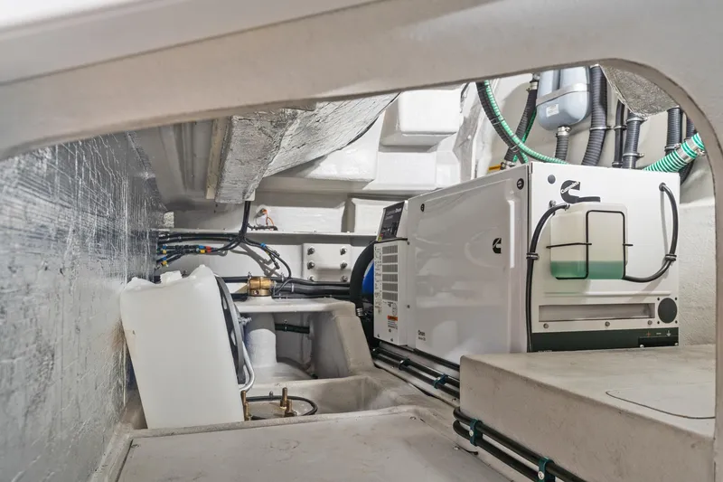 Slide: The Image of Engine room of 2019 Sunseeker Predator 57 yacht, featuring modern equipment and wiring. - 65