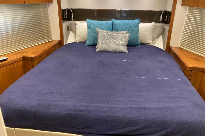 Slide: The Image of 2019 Sunseeker Predator 57 yacht cruising on open sea under blue sky. - 7