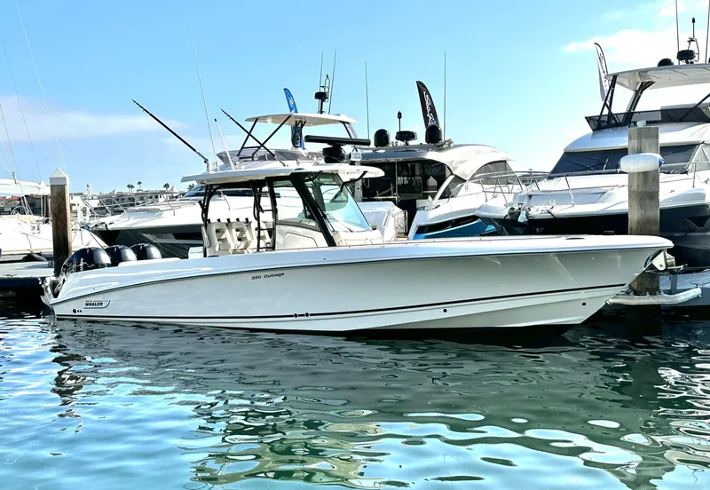 The Image of 2020 Boston Whaler 350 Outrage boat docked in a marina. - 0