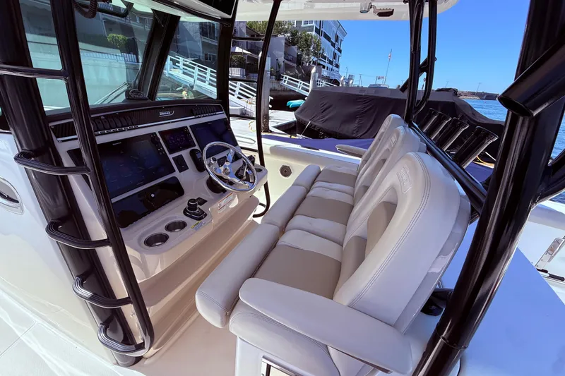 Slide: The Image of 2020 Boston Whaler 350 Outrage helm with modern controls and comfortable seating. - 14