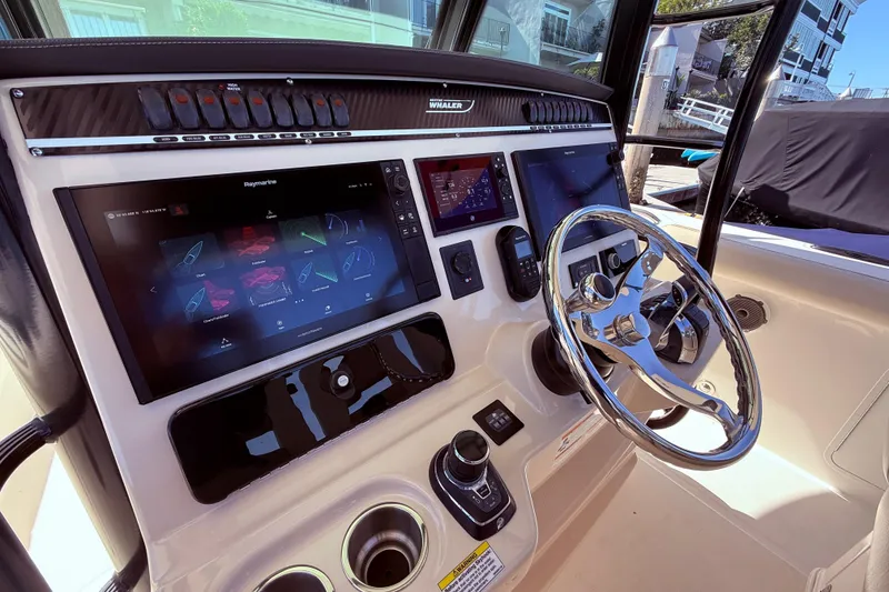 Slide: The Image of 2020 Boston Whaler 350 Outrage helm with advanced navigation and control systems. - 16