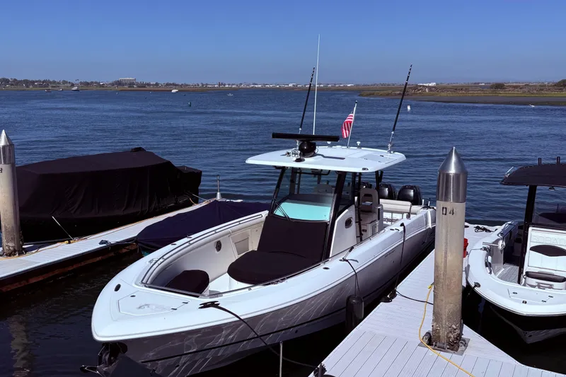 Slide: The Image of 2020 Boston Whaler 350 Outrage docked by the water on a sunny day. - 3