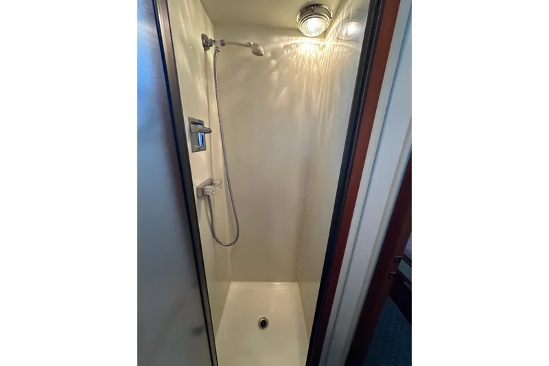 Slide: The Image of Shower area in 1984 Tollycraft 34 aft cabin yacht, featuring modern fixtures. - 17