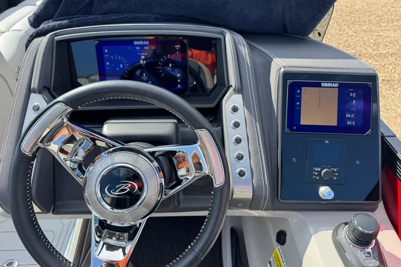 Slide: The Image of 2025 Barletta LUSSO 25UCAT dashboard with steering wheel and digital displays. - 21