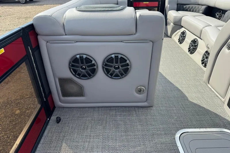 Slide: The Image of 2025 Barletta LUSSO 25UCAT interior with gray seating and built-in speakers. - 22