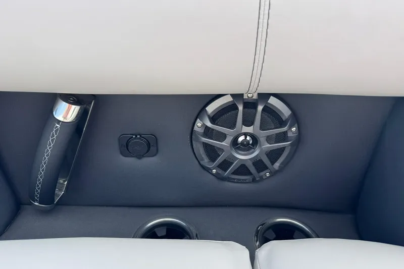 Slide: The Image of Barletta LUSSO 25UCAT 2025 interior with speaker, handle, and cup holders. - 26